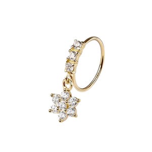 May include: A gold nose ring with a floral pendant. The ring has a small hoop with a series of clear, square-cut stones. A flower-shaped charm, set with clear stones, hangs from the ring, adding a touch of elegance. A stylish piece of jewellery.