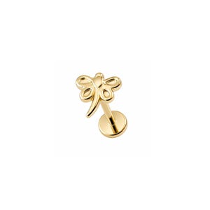 May include: A gold-toned dragonfly stud earring featuring a flat circular backing and a post. The dragonfly design is rendered in a polished metallic finish with symmetrical wing detailing and a slender body extending toward the base post.