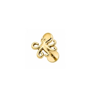 May include: A gold-toned flat back stud earring featuring a polished octopus design. The octopus has a smooth, rounded head and eight curved tentacles extending outward. The stud includes a circular base plate attached to a short post behind the figure.