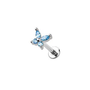 May include: A silver-toned labret stud featuring a butterfly-shaped top adorned with four light blue marquise-cut gemstones. The jewelry piece includes a straight post and a flat circular disc base, designed for body piercing applications.