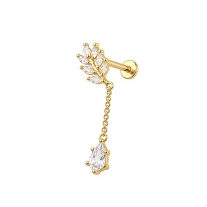 May include: A gold-colored earring with a leaf design and a dangling teardrop-shaped gem. The earring features a post for piercing and a chain connecting the leaf and the gem. The gems are clear and sparkly.
