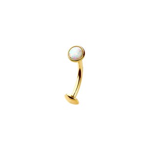 May include: A curved eyebrow piercing with a gold-colored bar and a round, white opal stone at the top. The piercing has a curved design and a flat base.