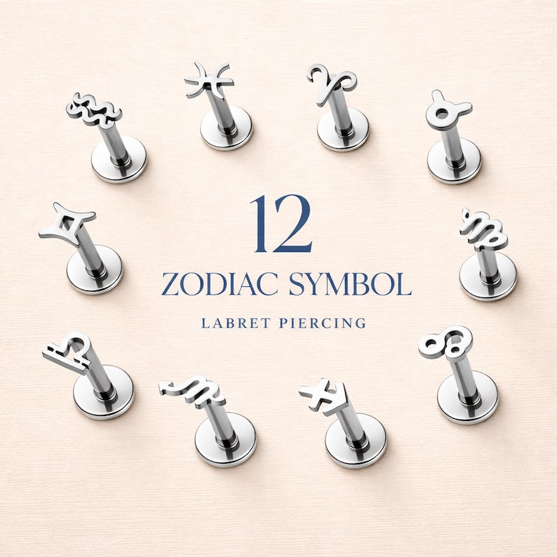 May include: Twelve silver-toned metal labret piercings arranged in a circle, each featuring a unique zodiac symbol on the flat top. The text 12 ZODIAC SYMBOL LABRET PIERCING is centered in the middle of the circular arrangement of jewelry pieces.