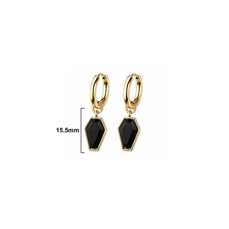 May include: A pair of gold-toned hoop earrings featuring dangling black coffin-shaped charms. The charms measure 15.5mm in length as indicated by the adjacent measurement graphic. The earrings have a polished metallic finish and a simple hinged closure.