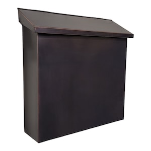 May include: A dark bronze mailbox with a sloped roof. The mailbox is made of metal and has a rectangular shape.