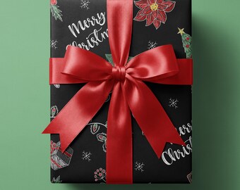 May include: A rectangular gift box wrapped in black paper with a white hand-drawn pattern of poinsettias, Christmas trees, gifts, and snowflakes. The text Merry Christmas is written in white script. A large, vibrant red satin ribbon is tied on top.