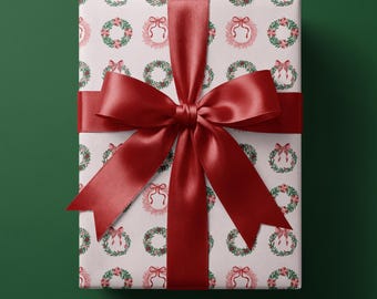 ピンクのクリスマス包装紙｜ホリデーリースとリボン