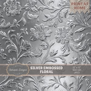 Puede incluir: Diseño floral plateado en relieve con un patrón repetido de flores y hojas. La imagen incluye el texto "Print at Home", "Silver Embossed Floral" y "12 x 12". El diseño es en tonos plateados y grises.