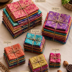 May include: A bundle of Pure Silk Scraps featuring stacks of patterned fabric in various colours tied with twine. The stacks are labelled with dimensions including 10 x 10 inch, 8 x 8 inch, 6 x 6 inch, 5 x 5 inch, 4 x 4 inch, and 3 x 3 inch sizes.