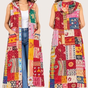May include: A sleeveless, knee-length hooded waistcoat featuring a vibrant patchwork design composed of various rectangular fabric segments in shades of red, yellow, pink, blue, and green. The garment includes two front pockets and visible stitching.