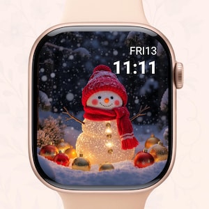 May include: A smartwatch with a festive snowman display. The screen shows a snowman wearing a red hat and scarf, surrounded by snow and Christmas ornaments. The time is 11:11, and the date is Fri13.