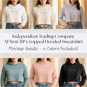 May include: A mockup bundle of six cropped hooded sweatshirts in various colours: cream, beige, grey, teal, peach, and black. The sweatshirts have a drawstring hood and a cropped design. The text "Independent Trading Company AFX64CRP Cropped Hooded Sweatshirt Mockup Bundle - 6 Colors Included!" is displayed.
