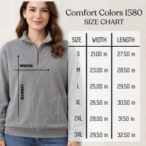 May include: A gray Comfort Colors 1580 quarter-zip sweatshirt with a size chart. The chart lists sizes S to 3XL, with width measurements from 21.00 inches to 29.50 inches and lengths from 27.50 inches to 32.50 inches.