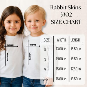 May include: Two children wearing white long-sleeve shirts. The image includes a size chart for Rabbit Skins 3302 shirts, with measurements in inches for sizes 2T to 5-6T. The chart shows width and length dimensions.