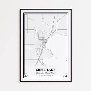 May include: A framed black and white map print of Shell Lake, Wisconsin, United States. The map shows detailed street layouts and geographical features. The text "Shell Lake, Wisconsin, United States" is displayed at the bottom, along with the coordinates.