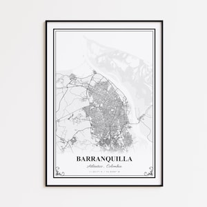 May include: A framed black and white map print of Barranquilla, Colombia. The city map is detailed with roads and infrastructure, set against a grayscale background. The city name and coordinates are printed at the bottom.