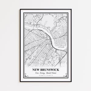 May include: A framed black and white map print of New Brunswick, New Jersey, United States. The map shows the city's layout, streets, and waterways. The print includes the city name, state, and coordinates.