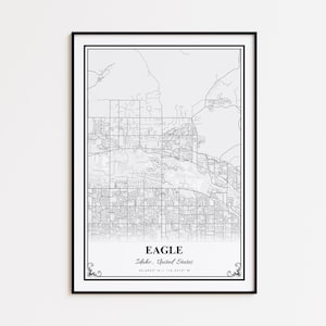 May include: A framed black and white map print of Eagle, Idaho, United States. The map details the city's layout with streets and geographical features. The city name and coordinates are printed at the bottom.