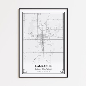 May include: A framed black and white map print of LaGrange, Indiana, USA. The map features a detailed street layout, with the city name and coordinates at the bottom. The print is encased in a black frame.