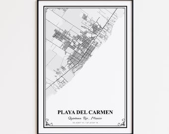 May include: A framed black and white map print of Playa del Carmen, Quintana Roo, Mexico. The map shows the city's layout with streets and surrounding areas. The text "PLAYA DEL CARMEN" is centered at the bottom, with coordinates below.
