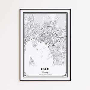 May include: A framed black and white map print of Oslo, Norway. The map shows the city's layout with roads and waterways. The city name and coordinates are printed at the bottom. The print is in a black frame.
