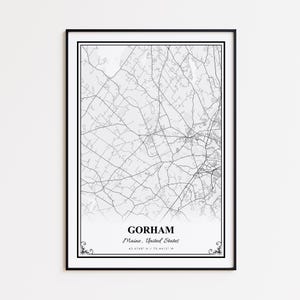 May include: A framed black and white map print of Gorham, Maine, United States. The map features intricate road and geographical details. The town's name, state, and coordinates are printed in a serif font at the bottom of the print.