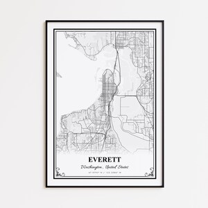 May include: A framed black and white map print of Everett, Washington, United States. The map shows the city's layout, including roads, waterways, and urban areas. The print is encased in a black frame with decorative flourishes at the bottom.