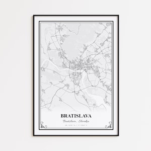 May include: Black framed print featuring a detailed grayscale map of Bratislava, Slovakia. The city's road network and geographical features are visible. The city name and coordinates are printed at the bottom. Decorative flourishes are at the corners.