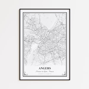 May include: Framed black and white map print of Angers, Maine-et-Loire, France. The detailed map shows the city's layout, including roads, rivers, and urban areas. The print includes the city name and coordinates.