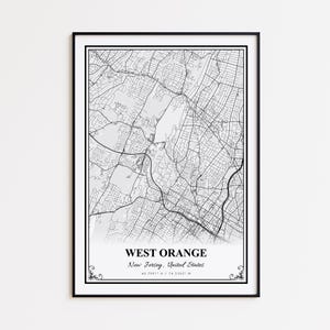 May include: A framed black and white map print of West Orange, New Jersey, USA. The detailed map shows streets and roads, with the city name and coordinates at the bottom. The print is in a black frame.