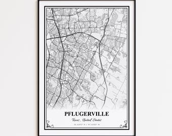 May include: Black and white framed map print of Pflugerville, Texas, United States. The map shows the city's road network and is labeled with the city's name and coordinates. The print has a black border and decorative flourishes.
