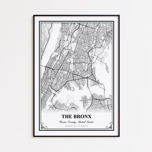 May include: A framed black and white map print of The Bronx, New York. The map details the streets and waterways of the borough. The text "THE BRONX" is centered at the bottom, with the county and coordinates below.