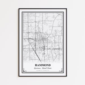 May include: A framed black and white map print of Hammond, Louisiana, United States. The map shows the city's road network and is labeled with the city name and coordinates. The print is in a black frame.