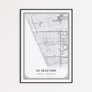 May include: A framed black and white map print of El Segundo, California, United States. The map details the city's layout with streets and buildings. The city name and coordinates are printed at the bottom, with decorative flourishes.