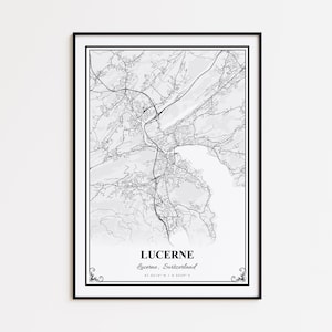May include: Black framed print of a map of Lucerne, Switzerland. The map is in black and white, showing the city's layout with roads and waterways. The city name and coordinates are printed at the bottom.