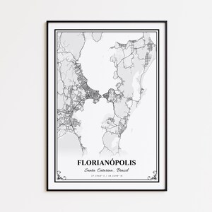 May include: Black framed print featuring a detailed grayscale map of Florianópolis, Santa Catarina, Brazil. The map includes roads, waterways, and land features. The city name and coordinates are printed at the bottom.