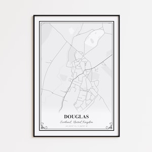 May include: A framed black and white map print of Douglas, Scotland, United Kingdom. The map features a detailed street layout with the town's name and coordinates at the bottom. The print is encased in a black frame.