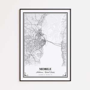 May include: Black framed print featuring a detailed grayscale map of Mobile, Alabama, United States. The city name and coordinates are printed at the bottom. The map includes roads, waterways, and urban areas.