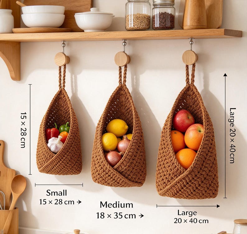 May include: Three brown crocheted hanging baskets in small, medium, and large sizes. The small basket measures 15 x 28 cm, medium 18 x 35 cm, and large 20 x 40 cm. They are filled with fresh produce including peppers, garlic, lemons, onions, apples, and oranges.
