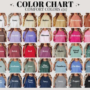 May include: A color chart displays a variety of Comfort Colors t-shirts. The chart showcases a range of hues, including white, ivory, and black, with names like "Banana," "Berry," and "Navy" printed above each color swatch.
