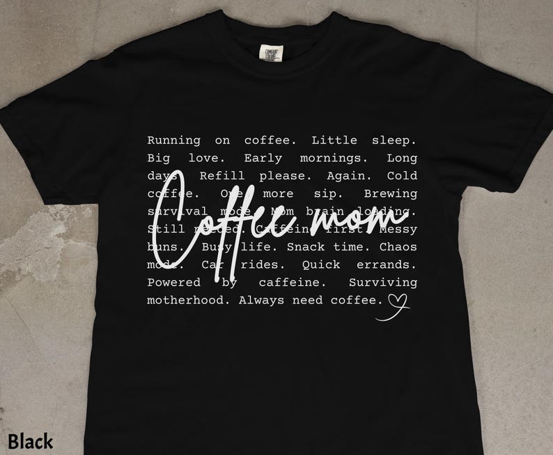 May include: Black t-shirt with white text. The shirt features the words "Coffee Mom" in a cursive font, with a list of coffee-related phrases. The shirt is a crew neck and made of a soft material.