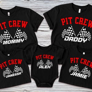 May include: Black t-shirts with the text "PIT CREW" in red, and a checkered flag design. The shirts are labeled "MOMMY", "DADDY", "JANESSA", "ALEX", and "JAMIE".