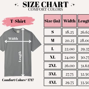 May include: A size chart for Comfort Colors T-shirts, with measurements in inches. The chart includes sizes S to 4XL, detailing width and length for each size. The T-shirt is gray.