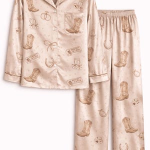 May include: A distressed wooden sign, reading "Welcome to our home" in white lettering. The sign has a rustic finish, ideal for a front door or hallway, creating a welcoming atmosphere.