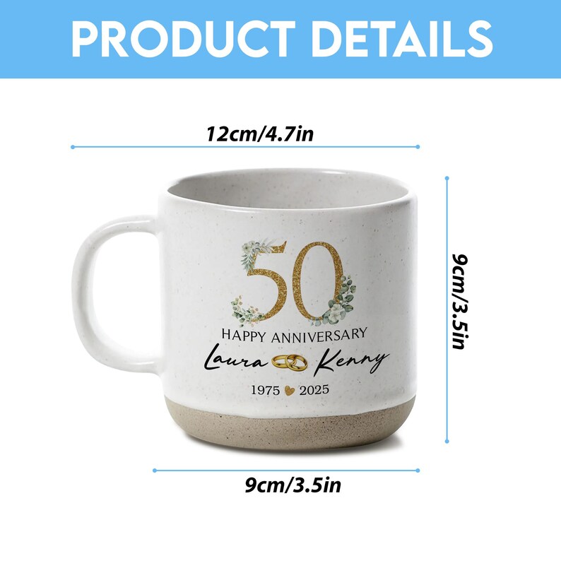 May include: A white ceramic mug with a beige base, featuring gold-colored "50" with floral accents, "Happy Anniversary", and names "Laura & Kenny". The mug is 3.5 inches wide, 3.5 inches tall, and 4.7 inches wide.