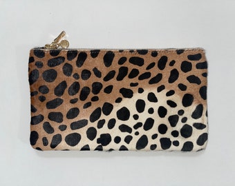 Fierce and Fashionable: Cheetah Print Lambskin Pouch with Luxurious Gold Hardware