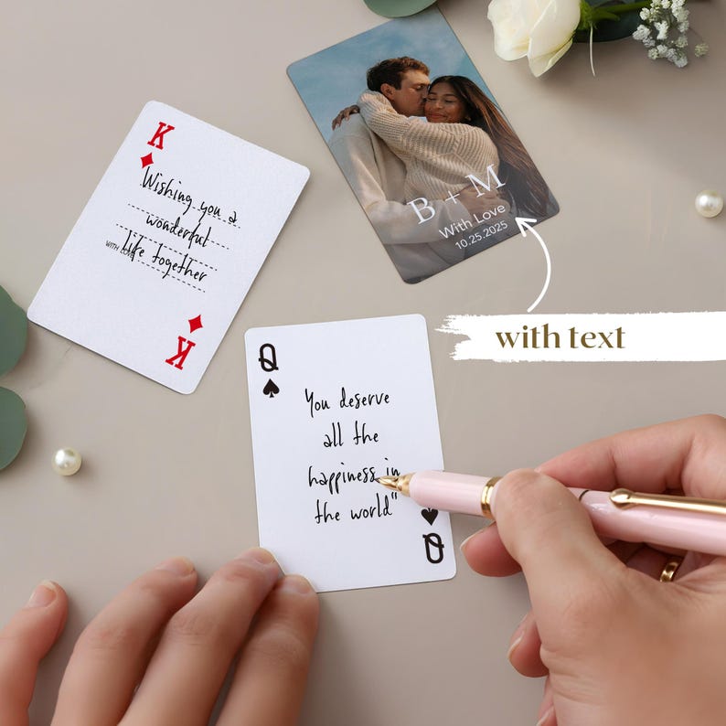 May include: Playing cards with handwritten text and a photo card. One card reads "Wishing you a wonderful life together." Another says "You deserve all the happiness in the world." The photo card shows a couple with the text "B+M With Love 10.25.2025."