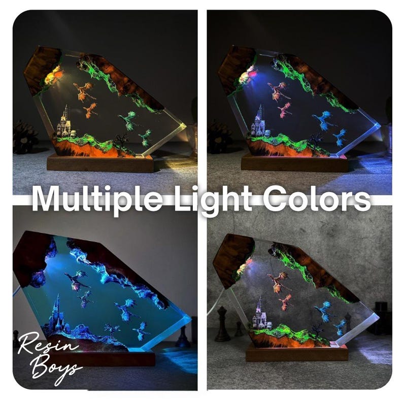 Puede incluir: L&aacute;mpara decorativa de resina con m&uacute;ltiples opciones de color de luz. Presenta una escena de fantas&iacute;a con dragones, un castillo y un paisaje. La base es de madera. El texto "Multiple Light Colors" y "Resin Boys" es visible.