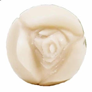 May include: A white, round, decorative soap with a rose design.