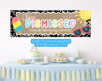 May include: A banner with the words "Class DISMISSED have an amazing summer!" is displayed above a table set for a party. The banner includes a popsicle, sunglasses, and a sun illustration. The table is decorated with a blue tablecloth and tassels.
